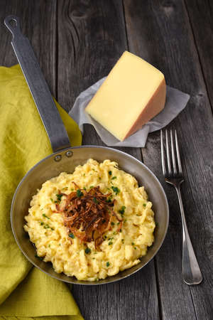 Cheese spÃ¤tzle on wooden tableの写真素材