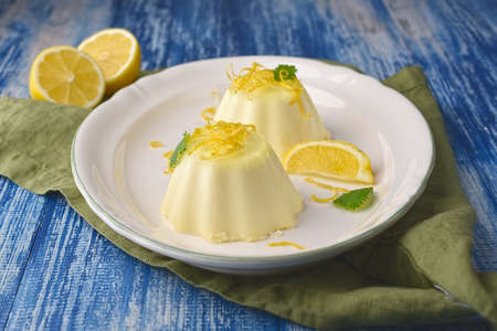 Lemon panna cotta with mint and lemon zest.