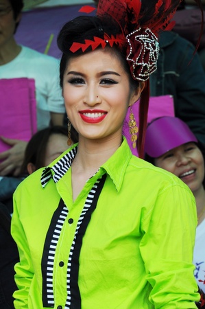 Cheerleaders rising pom-poms, (portrait) at Nan Province of thailandのeditorial素材