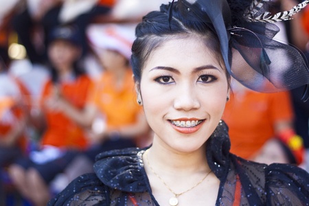 Cheerleaders rising pom-poms, (portrait) at Nan Province of thailandのeditorial素材