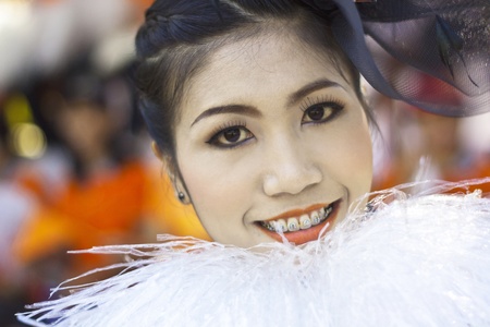 Cheerleaders rising pom-poms, (portrait) at Nan Province of thailandのeditorial素材