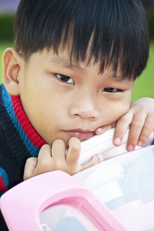 A little Boy in Car Toy pink colorの写真素材