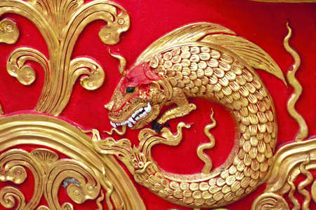 The gold stucco design of native thai style on the Wallの写真素材