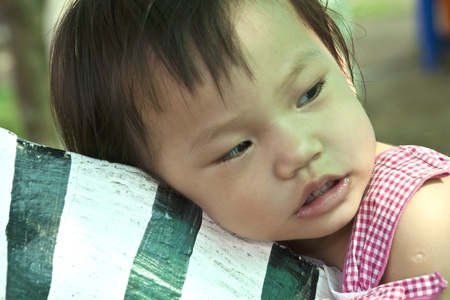 Asian Kid Playing In Playgroundの写真素材
