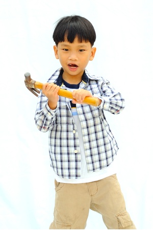 Little boy with tools - isolated on white backgroundの写真素材