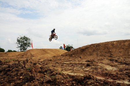 NAN, THAILAND - JUN 02: An unidentified rider participates in the 3rd round (test drive) of Motocross 2012 Thailand motocross Junior championship on June 02, 2012 in Nan Province, Thailand.のeditorial素材