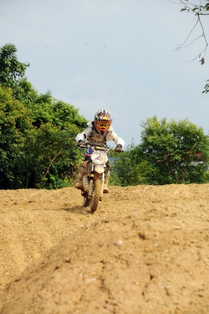 NAN, THAILAND - JUN 02: An unidentified rider participates in the 3rd round (test drive) of Motocross 2012 Thailand motocross Junior championship on June 02, 2012 in Nan Province, Thailand.のeditorial素材