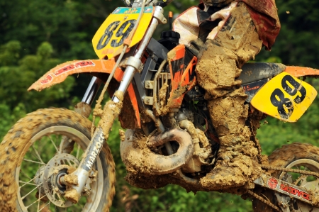 NAN, THAILAND - JUN 02: An unidentified rider participates in the 3rd round (test drive) of Motocross 2012 Thailand motocross Junior championship on June 02, 2012 in Nan Province, Thailand.のeditorial素材
