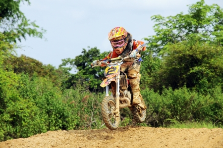 NAN, THAILAND - JUN 02: An unidentified rider participates in the 3rd round (test drive) of Motocross 2012 Thailand motocross Junior championship on June 02, 2012 in Nan Province, Thailand.のeditorial素材