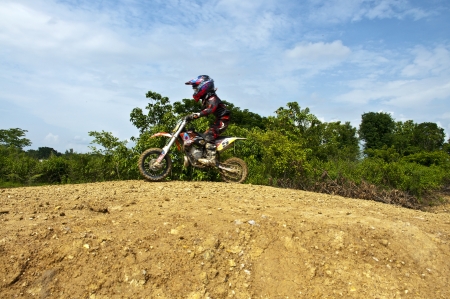 NAN, THAILAND - JUN 02: An unidentified rider participates in the 3rd round (test drive) of Motocross 2012 Thailand motocross Junior championship on June 02, 2012 in Nan Province, Thailand.のeditorial素材