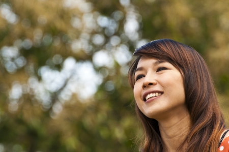 Portrait Of Asian Young Woman In garden in winter seasonの写真素材