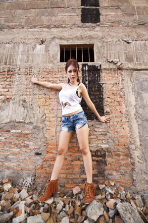 Beautiful young Asian woman wearing blue short jeanの写真素材