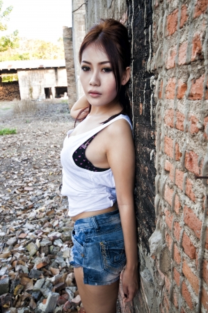 Beautiful young Asian woman wearing blue short jeanの写真素材
