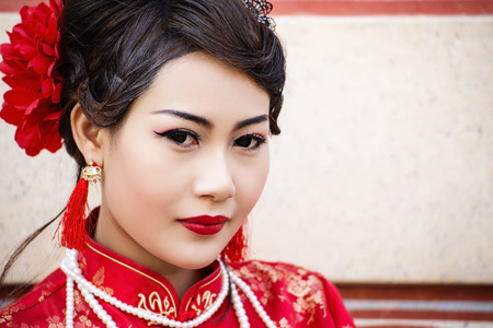 Chinese woman in red dress traditional cheongsamの写真素材