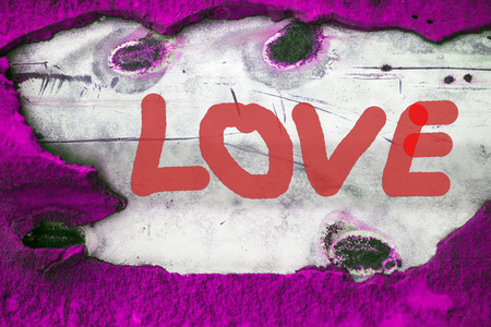 RED Word LOVE (uppercase) on old vintage pink backgroundの写真素材