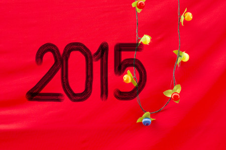 Chinese Calligraphy 2015 Year of the Goat 2015 on red silk fabric backgroundの写真素材