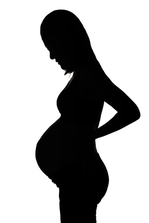 Silhouette of a pregnant womanの写真素材