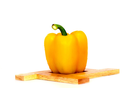 Yellow Sweet bell pepper capsicum isolated on white backgroundの写真素材