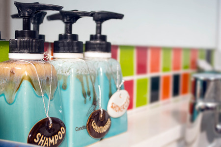 Bathroom interior with  body care, luxury and hygiene concept - close up of liquid soap or body lotionの写真素材