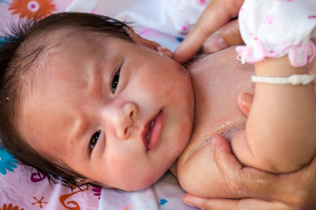 cute little asian girl taking a bathの写真素材