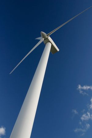 Wind power station against the sky and clouds