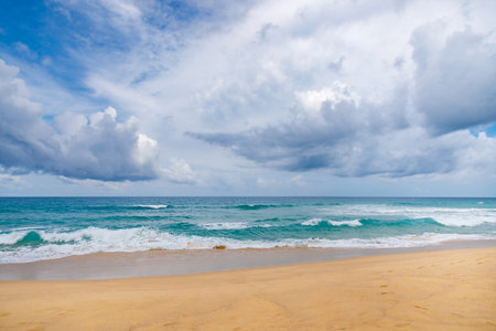 Beautiful sea Sunny landscape on the beach. Light waves of blue color spread all over the beach smoothly smoothing the Golden sand.の写真素材