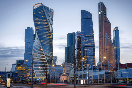 Russia Moscow-City 16.03.2020 International Business Center. Evening time, reflection of lights in the river. Buildings made of glass.のeditorial素材