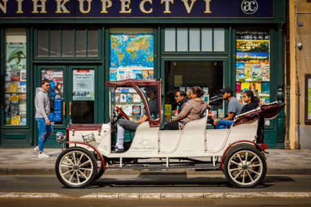 Czech Republic 14 april 2018 Vintage cars for tourist excursions. Beige convertible car on the road...