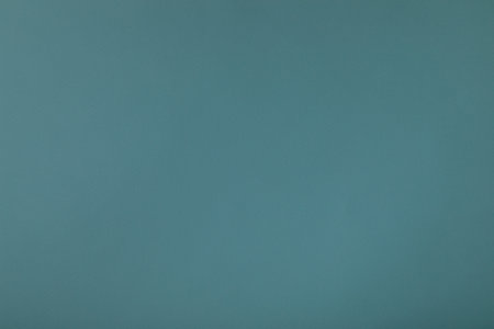 Blue background with paper texture, horizontal, blank space.の写真素材