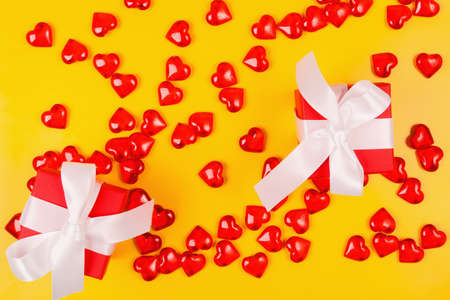 Valentine's Day, composition of hearts on a yellow background. View from above. Space for text, flat...