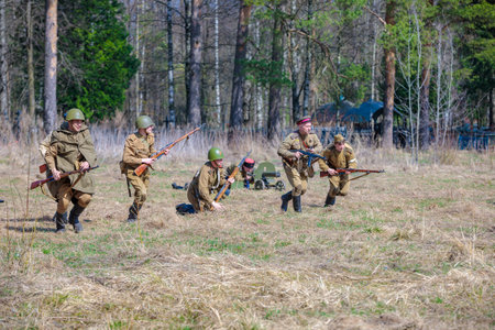Reconstruction of the Second World War. Russian partisan detachment goes on the attack. The Great Patriotic War. Liberation of Odessa. Zelenograd Russia April 18, 2021のeditorial素材