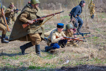 Reconstruction of the Second World War. Russian partisan detachment goes on the attack. The Great Patriotic War. Liberation of Odessa. Zelenograd Russia April 18, 2021のeditorial素材
