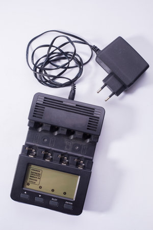 Charger with large display. Black device with long power cord