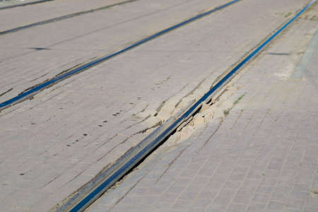 Tram tracks in an urban environment. Pits at the junction of the rails