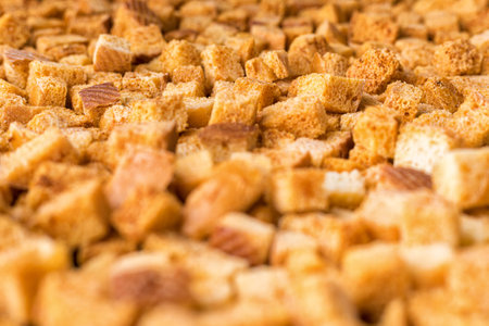 Square-shaped bread crumbs. Oven-fried golden brown bread crumbs.の写真素材