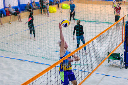 Man playing volleyball on the sandのeditorial素材