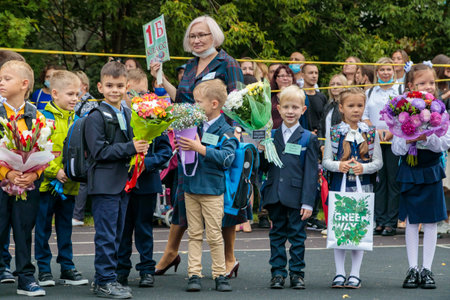 First graders walk with bouquets on September 1. Children go to school, first grade with flowers....