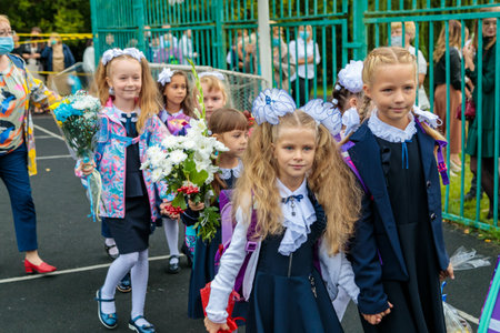 First graders walk with bouquets on September 1. Children go to school, first grade with flowers. School education concept. Moscow, Russia, September 1, 2021のeditorial素材