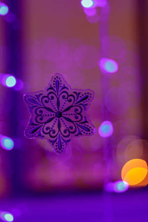Pink bokeh on a lilac, purple background. The light is out of focus.の写真素材