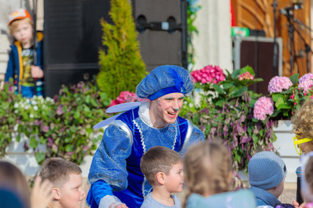 A man dressed as a fairy-tale hero entertains children at a party. Moscow Russia April 23, 2022
