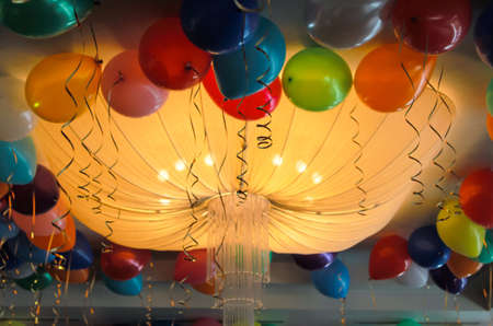 Multi-colored balls around the chandelier in the form of a sphere. Decoration for the holidayの写真素材