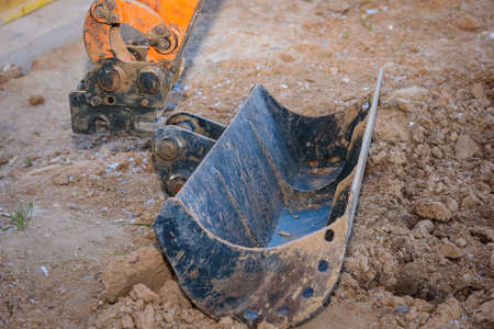 Repair of the excavator bucket, replacement of the nozzle on the boomの写真素材