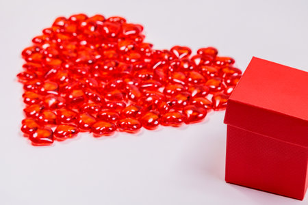 Gift box on the background of a big heart. The concept of congratulations, love