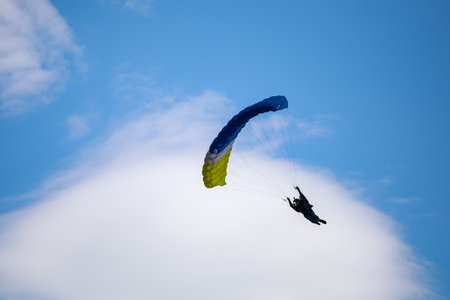 parachute in the sky. Skydiver is flying a parachute in the blue sky. high quality photoの写真素材