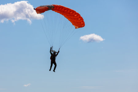 parachute in the sky. Skydiver is flying a parachute in the blue sky. high quality photoの写真素材