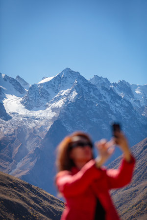 Portrait of a girl against the background of snowy mountains creates a magical moodの写真素材