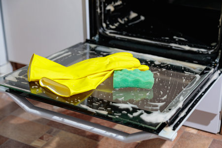 Thorough cleaning of kitchen appliances from grease and dirtの写真素材