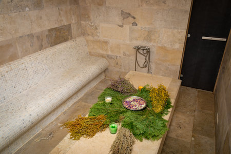 In the hammam, fragrant bath brooms are displayed on the table, complementing the atmosphere of relaxation and care. Their rich aromas and natural textures create a special harmony.の写真素材