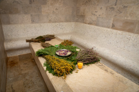 In the hammam, fragrant bath brooms are displayed on the table, complementing the atmosphere of relaxation and care. Their rich aromas and natural textures create a special harmony.の写真素材
