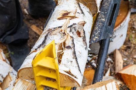The innovative device splits logs with ease, embodying the power of technology.の写真素材